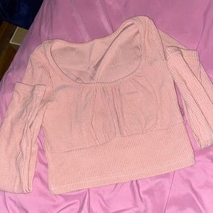 The shirt is pink but the picture with the brown shows how it looks